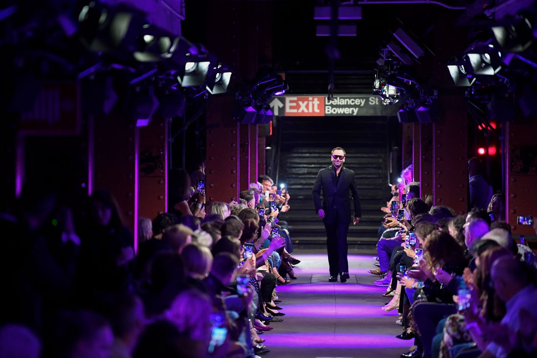 Tom Ford greets onlookers at the Spring Summer 2020 fashion show at the Bowery station.